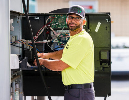 Photo of United Pump technician repairing a gas pump